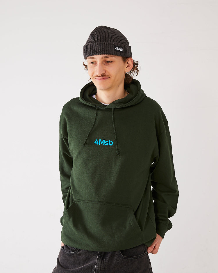 Skater wearing 4Msb fisherman beanie and 4Msb hoodie in the color forest green.