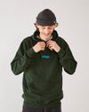 Skater wearing 4Msb fisherman beanie edge graphite grey and 4Msb hoodie in the color forest green.