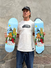 4Msb pro skateboarder Kilian Zehnder in white t-shirt holding his skateboard deck cities, pro model Kilian Zehnder in two variants: classic and TIPtech. The same colorful graphic of a cityscape with landmarks, trees and mountains on light blue background, showing Kilian Zehnder's four favorite cities: Barcelona, Sao Paulo, Zürich, San Francisco.