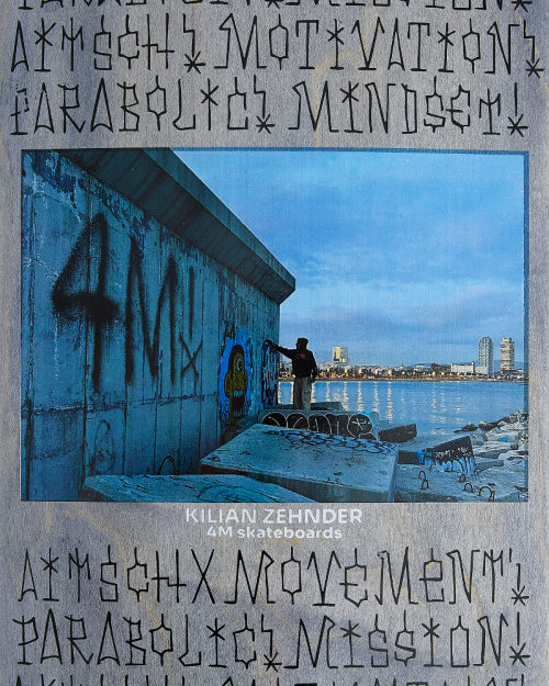 4Msb skateboard deck graffiti kilian zehnder pro model, close-up picture of the board showing the rider kilian doing the graffiti on the concrete wall by the sea in barcelona