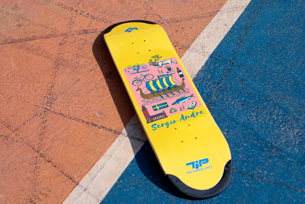 A yellow 4Msb TIPtech Sverige skateboard deck of pro rider Sérgio André and an illustration of various items related to Swedish culture on a concrete surface