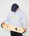 skateboarder wearing a navy blue 4Msb snapback cap with a yellow dala horse on the front, a heather grey skateovation hoodie core and holding a 4Msb skateboard deck with TIPtech in his hands.
