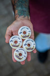 4Msb pro rider Rodrigo Leal showing his signature skateboard wheels 4 pack Drakkar Rodrigo Leal 53mm, white with drakkar boat in brown and gold and text in black.