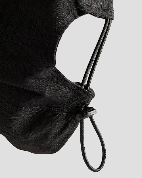 Black 4Msb skateboard cap Kilian Zehnder graffiti seen from the back, closeup of elastic cord adjustment with cord lock.
