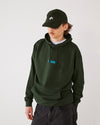 Skater wearing a olive green 4Msb corduroy cap Quatro and a matching forest green 4Msb hoodie.