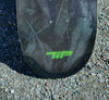 Close-up of the 4Msb Curupira skateboard deck with TIPtech. Detail photo showing the 'TIPtech' logo in green and on tip.