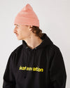Skateboarder wearing 4Msb cuffed beanie quatro in colour blush and skateovation hoodie core black.