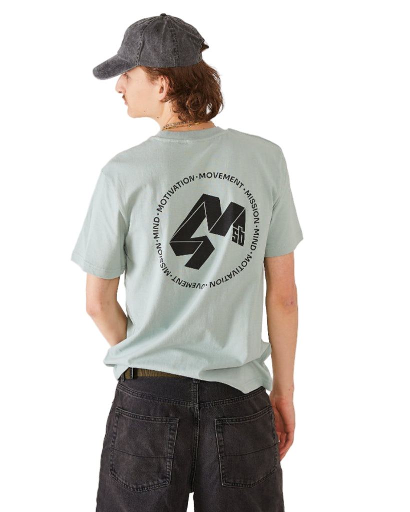 Skater wearing a light green t-shirt with a black 4Msb Quatro logo and text on the back, and a 4Msb dad cap vintage black.