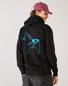 Skater seen from the back, his hand in his back pocket, wearing a 4Msb dad cap dala horse vintage red and a black 4Msb hoodie with dala horse motive in blue on the back.