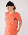 skater wearing a coral t-shirt 4Msb  Quatro fiesta red and a black skateovation harbour beanie Core 