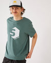 Skater wearing a skateovation t-shirt SO 720 colour green bay and SO trucker cap in black and white.