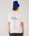 Skater wearing Skateovation SO Honeycomb T-shirt in off-white with a yellow honeycomb pattern on the back, and a royal blue Skateovation SO cuffed beanie.
