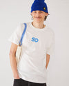 Skater wearing an off-white Skateovation T-shirt Honeycomb with SO logo on the chest and a royal blue Skateovation SO cuffed beanie.