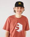 skater wearing a red brown skateovation t-shirt SO 720 heritage brown and a black trucker cap SO.