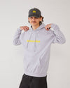 Skateboarder wearing a grey skateovation hoodie Edge with yellow text and a matching dad cap SO.