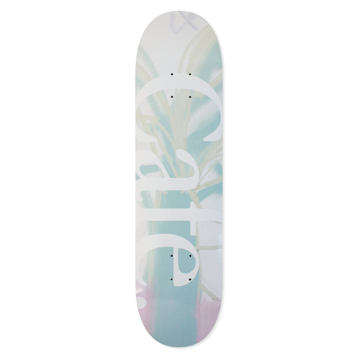 The Cafe Skateboard Deck JLH in Cream/Green, the deck graphic is are abstract pastel shades of green and cream with a large 'cafe' text on it.
