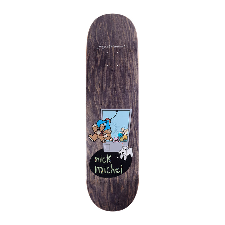 Frog skateboards nick michel claw machine skateboard deck, featuring dark dyed wood and a cartoon drawing of a claw machine with plushies. 