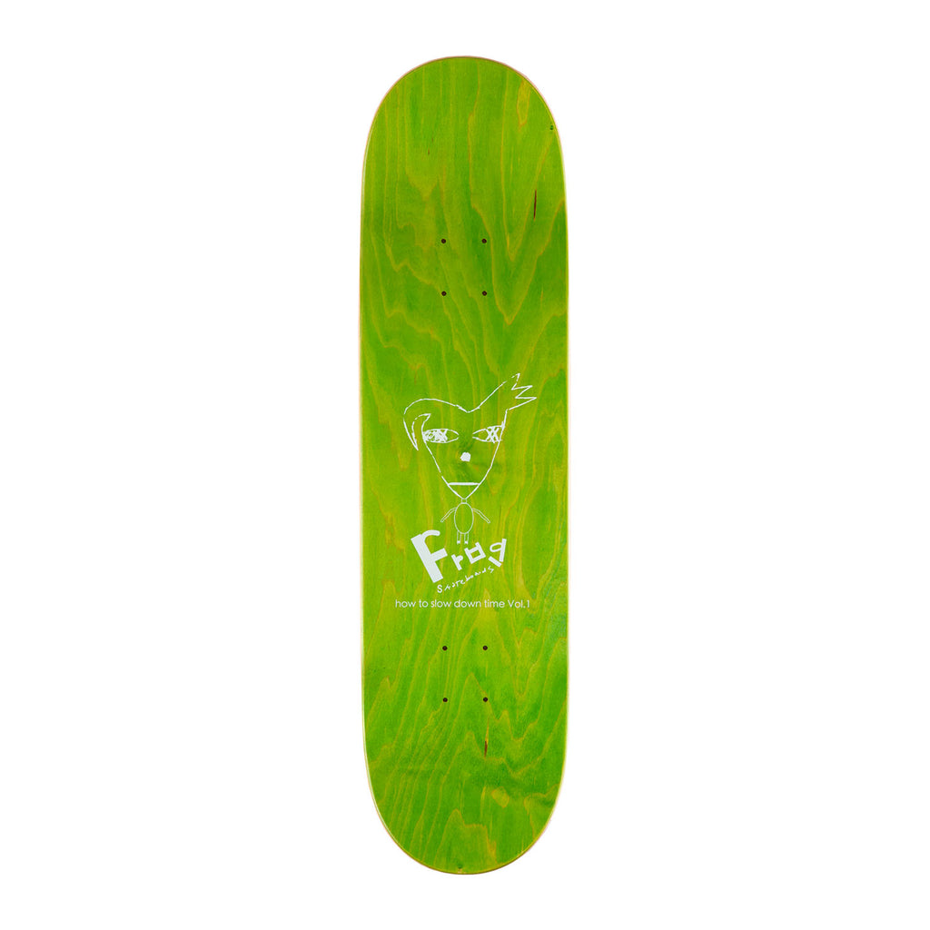Top view of frog skateboards Pat G technique deck, its dyed light green and has a cartoon creature on it as well as Frog branding.