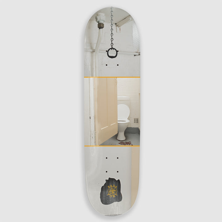The Pass~Port Skateboard Deck Plaster from the Dunny Hunt Series depicts a worn down bathroom with a white theme color.