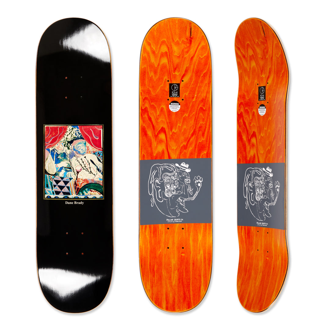 Three views of he polar skateboard deck for pro rider Dane Brady, time travelers, in brown. The bottom graphic is a dark brown with a colorful graphic design artwork in the middle and the top is dyed orange.