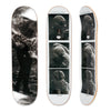 Three views of the Polar skateboard deck for pro rider Paul Grund, Stuntman B. The bottom graphic shows a stuntman on fire, the top graphic shows black and white images of a stuntman getting ready.