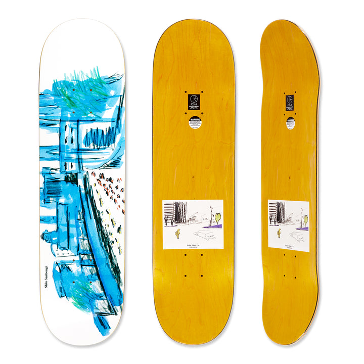 Three views of the Polar Skateboard Deck for pro rider Shin Sanbongi, Shin City. The bottom deck graphic shows a white deck with an artistic drawing of a city in blue and the top is a dyed yellow wood.