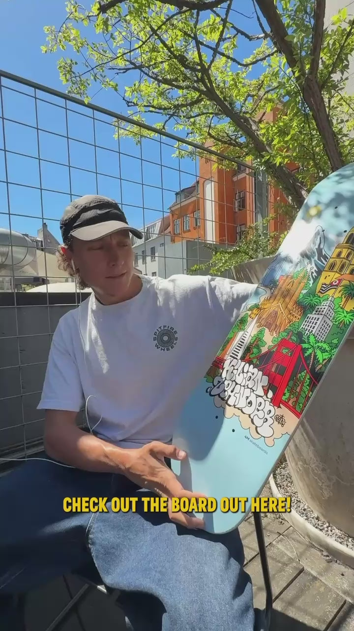 4Msb pro skateboarder shows and talks about is new pro model skateboard deck Cities, sitting on a sunny balcony, 2026.