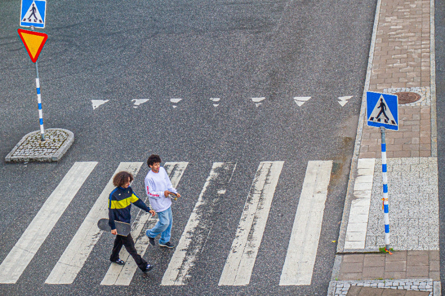4Msb skateboarders walking the street of stockholm carrying skateboard