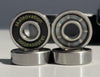 Skateovation skateboard bearings closeup of front, side and back of 4 bearings. Comes in set of 8 in a tin box.