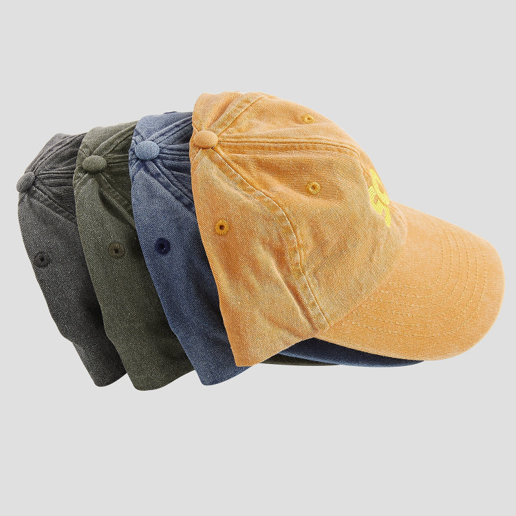 Four skateovation dad caps SO, viewed from the side, peak facing right: vintage black, vintage olive, vintage denim and vintage mustard.