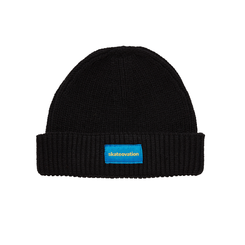 Skateovation harbour beanie core in the color black with Skateovation embroidered in yellow on blue at the front.