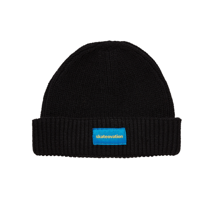 Skateovation harbour beanie core in the color black with Skateovation embroidered in yellow on blue at the front.