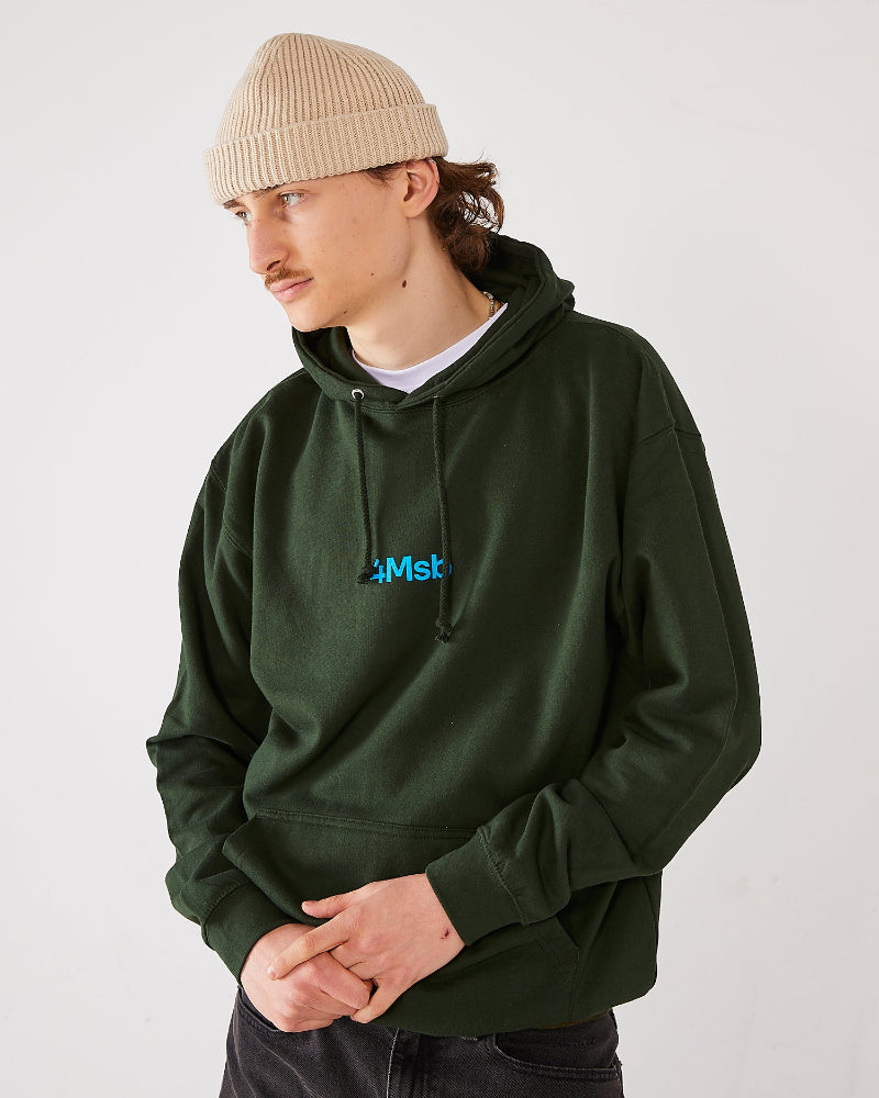 skaterborder wearing a forest green 4Msb hoodie and a oatmeal beige skateovation harbour beanie core.