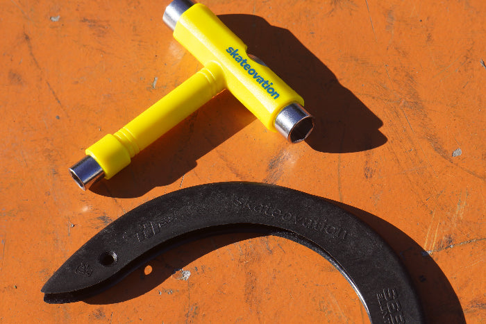 Yellow skateovation mounting tool core and black tip for skateboard decks.