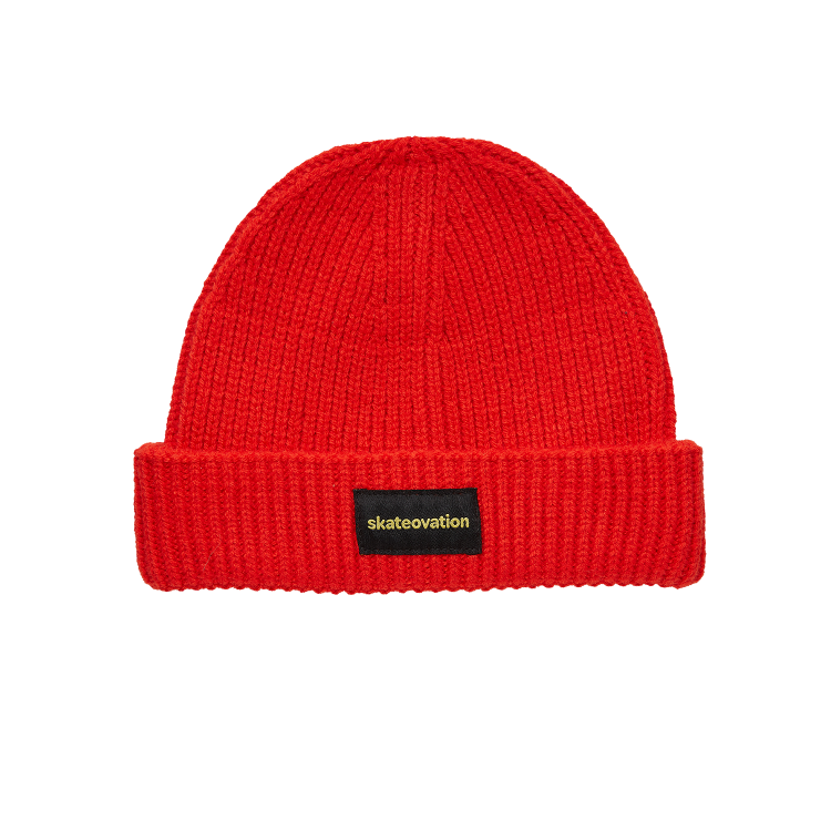 The Skatetovation harbour beanie core in the color fire red with skateovation texted in yellow on black at the front.