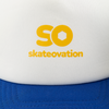 Blue white trucker cap, close-up on yellow 'SO skateovation' text on white front, and the blue peak.