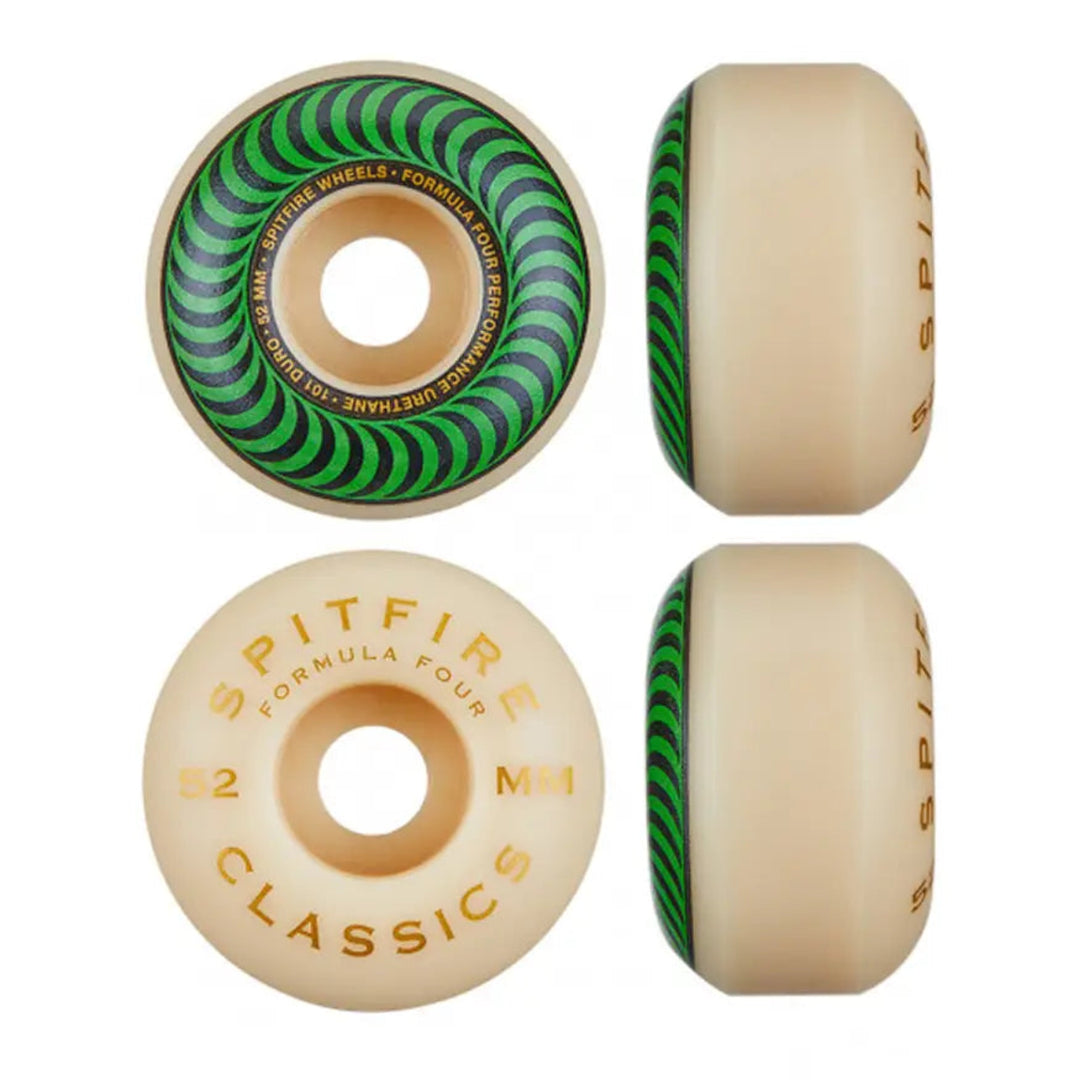 Four Spitfire Formula Four 52mm skateboard wheels shown from multiple angles on a plain white background. The wheels feature a white/cream-colored urethane body with gold foil stamping and a green and black spiral pattern on the inner barrel. 52mm and 11A hardness